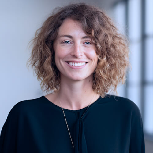 A New Zealand Female Business Owner Stands And Is Happy