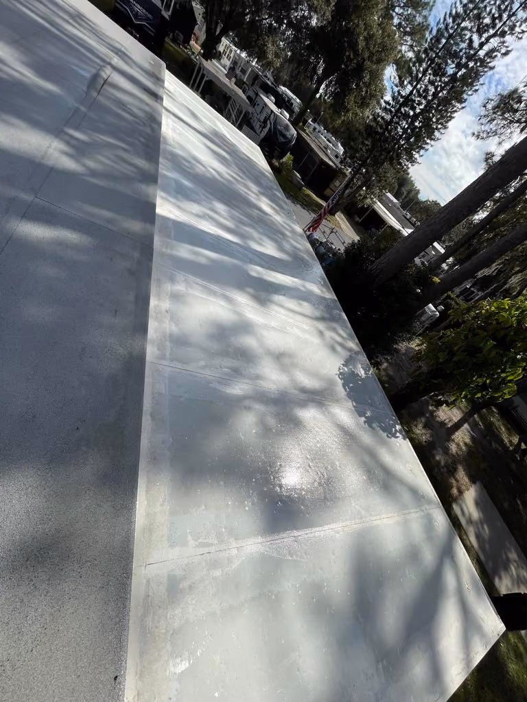 New flat roof coating and waterproofing installation