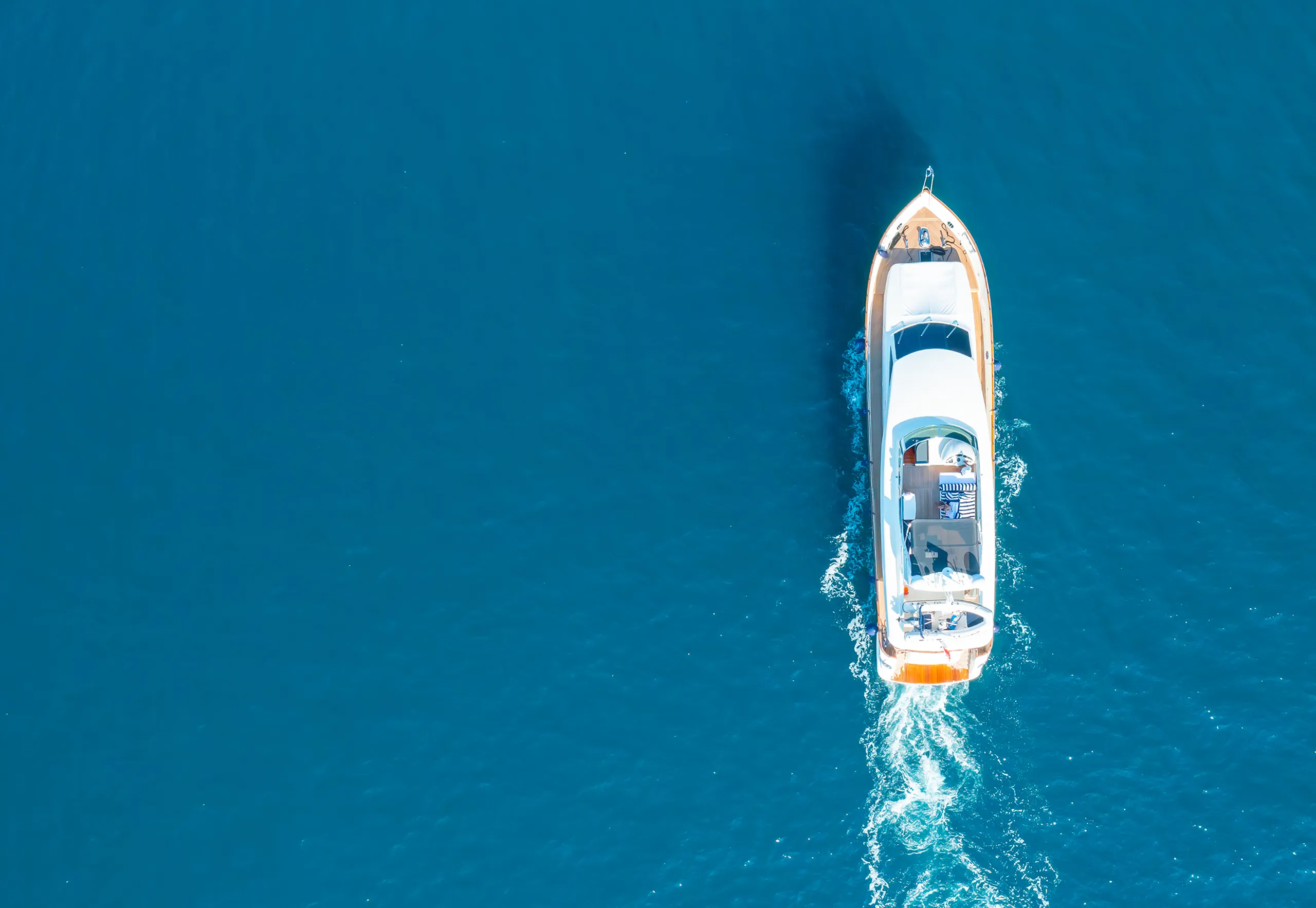 A yacht in the water cruising