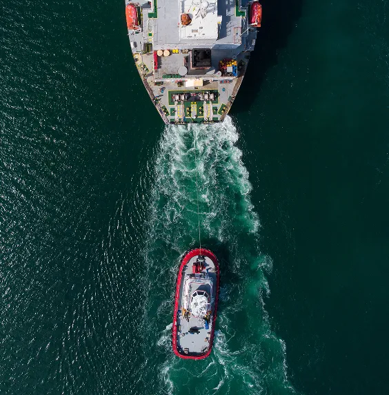 A large and small ship in the water