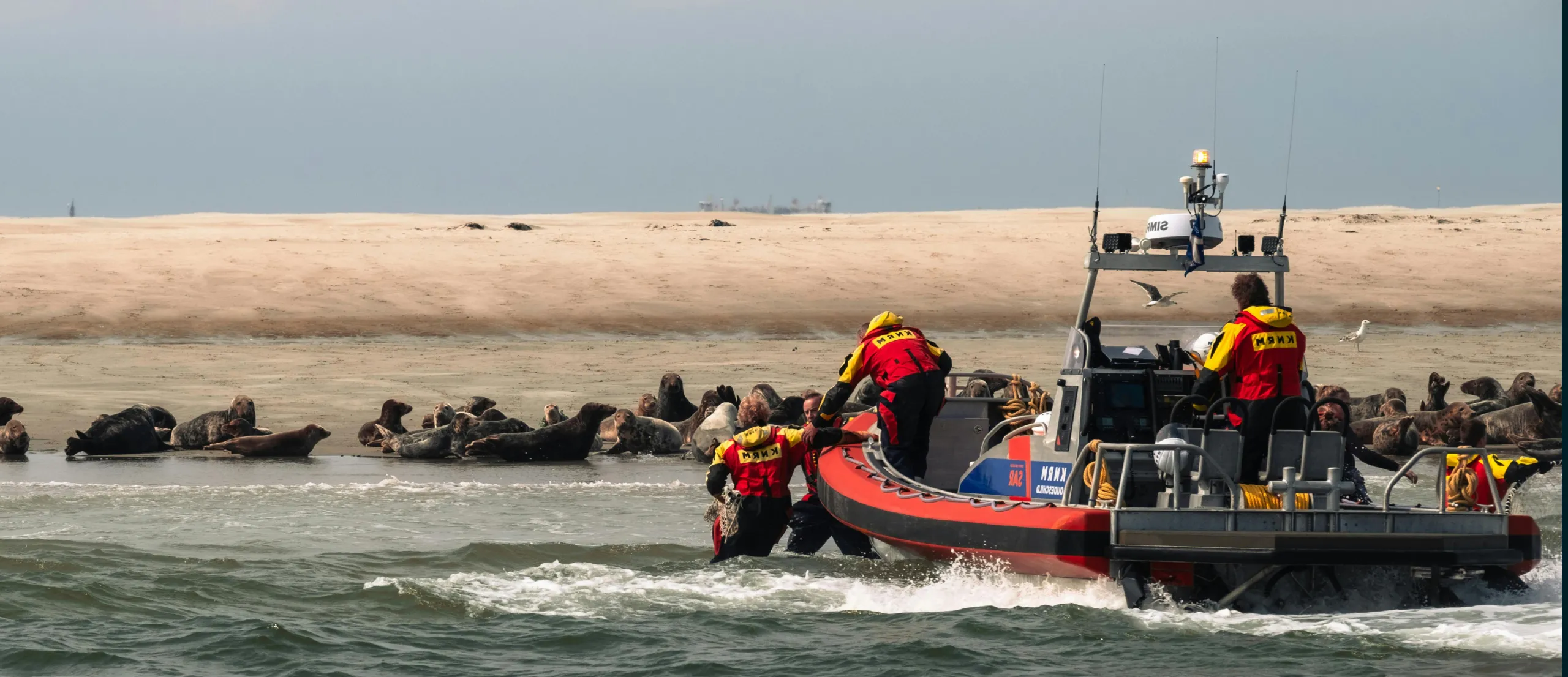 People with safety and security gear on a security boat