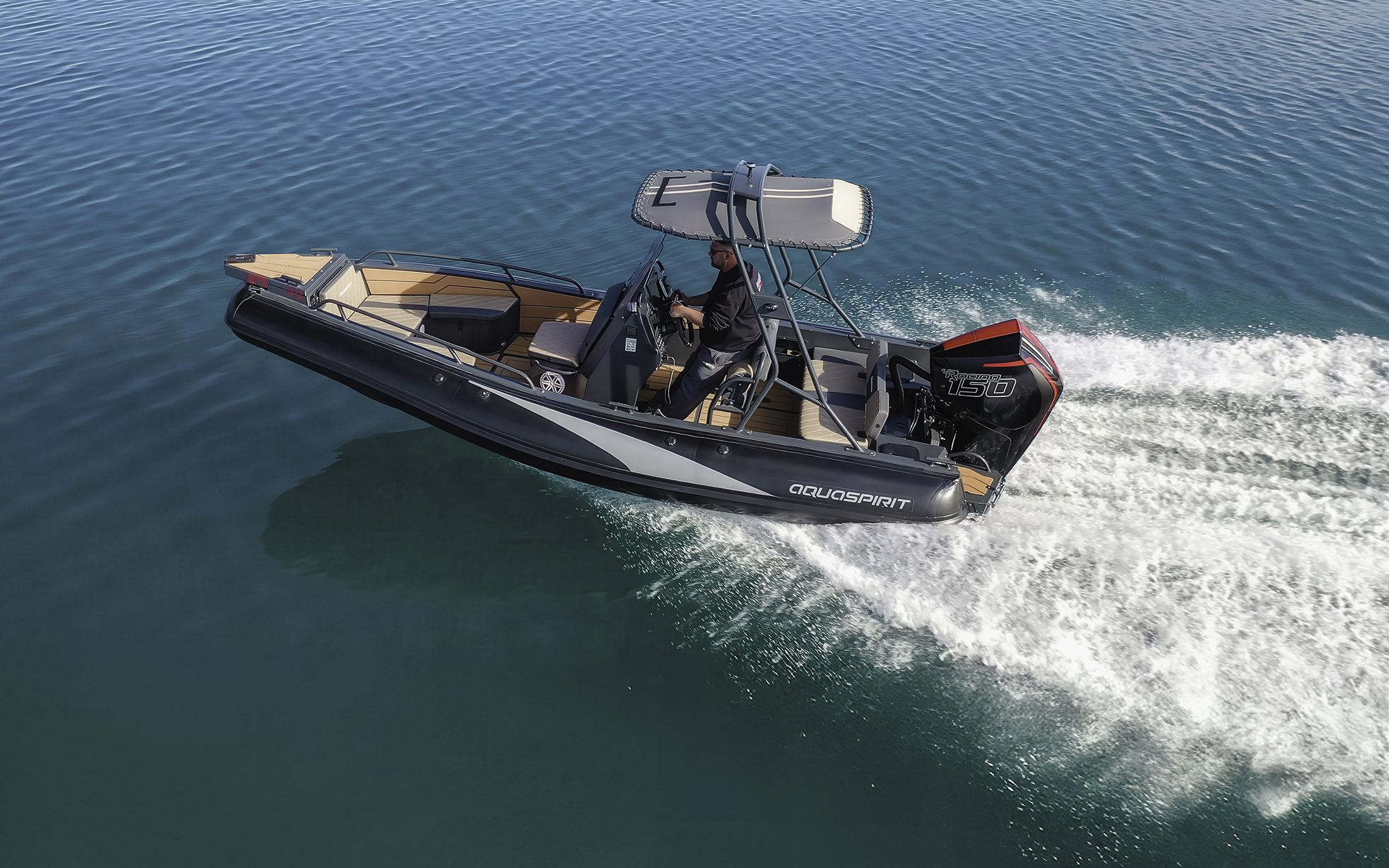 s585 rib boat is racing across the ocean. trough the water with Mercury Racing 150R Outboard engine, Greece coast