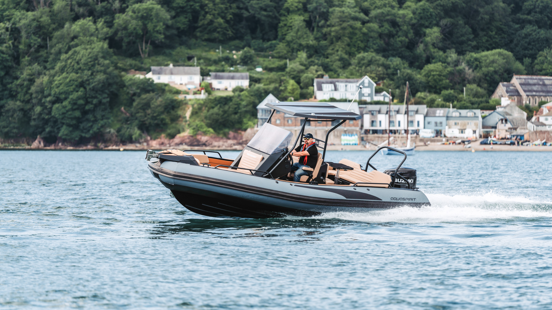 s700 premium rib boat is racing across the ocean. trough the water, California coast
