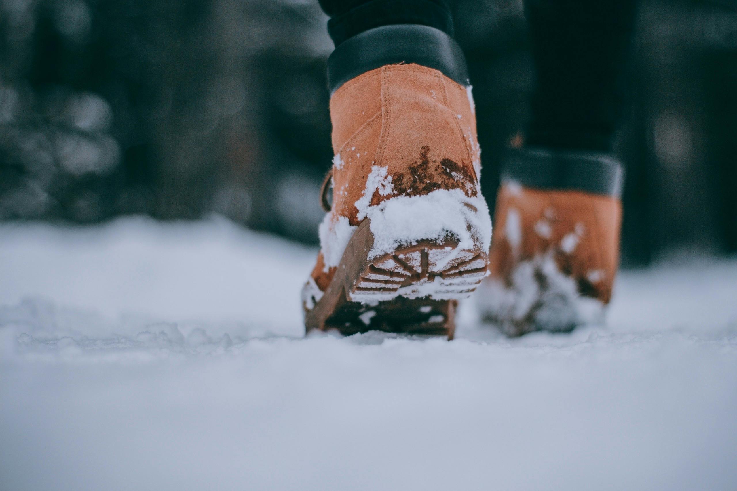 Person wearing boots in the snow