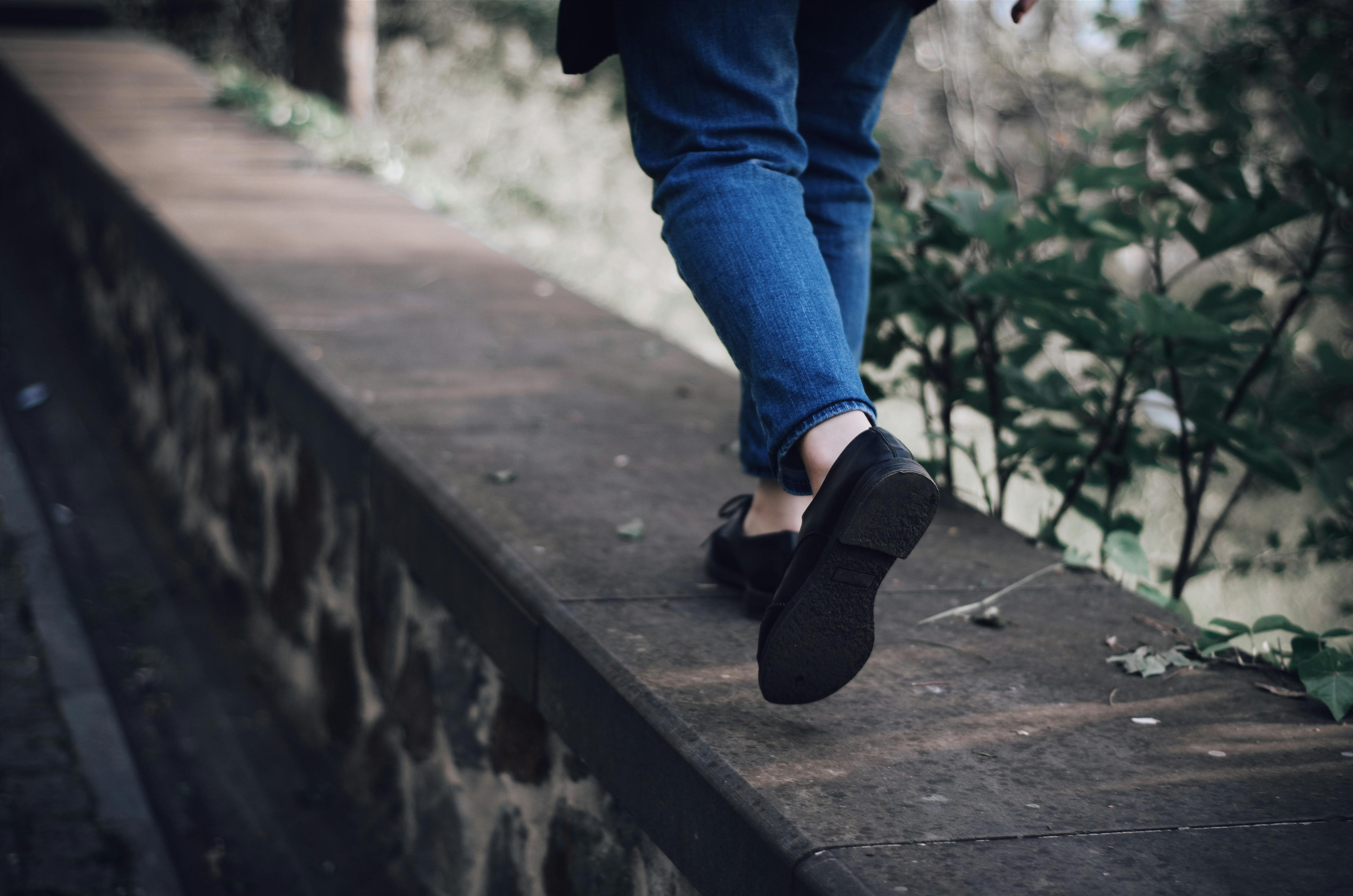 Shot of someone's legs as they're walking along a path