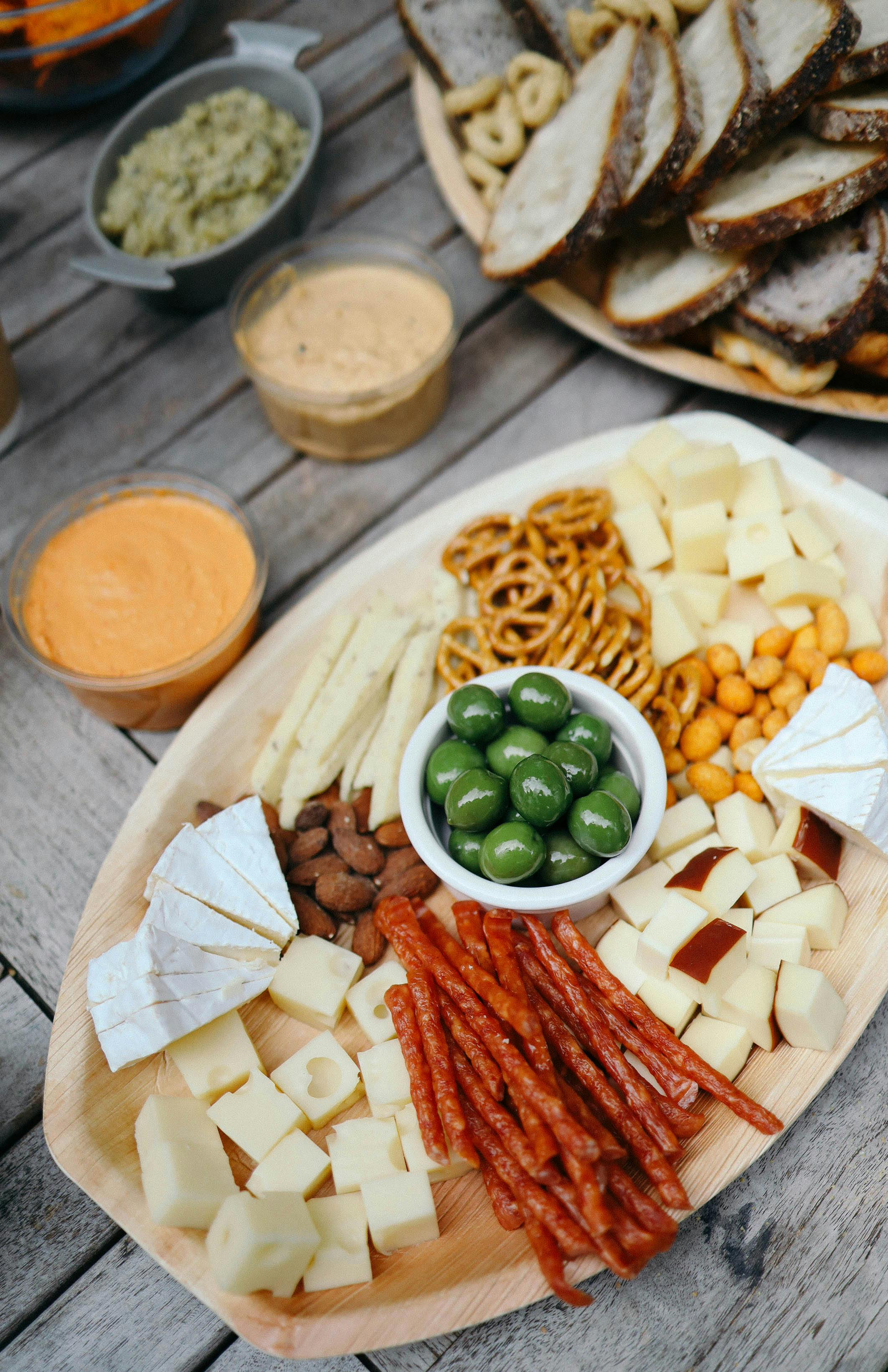 Table with assortment of breads and cheeses