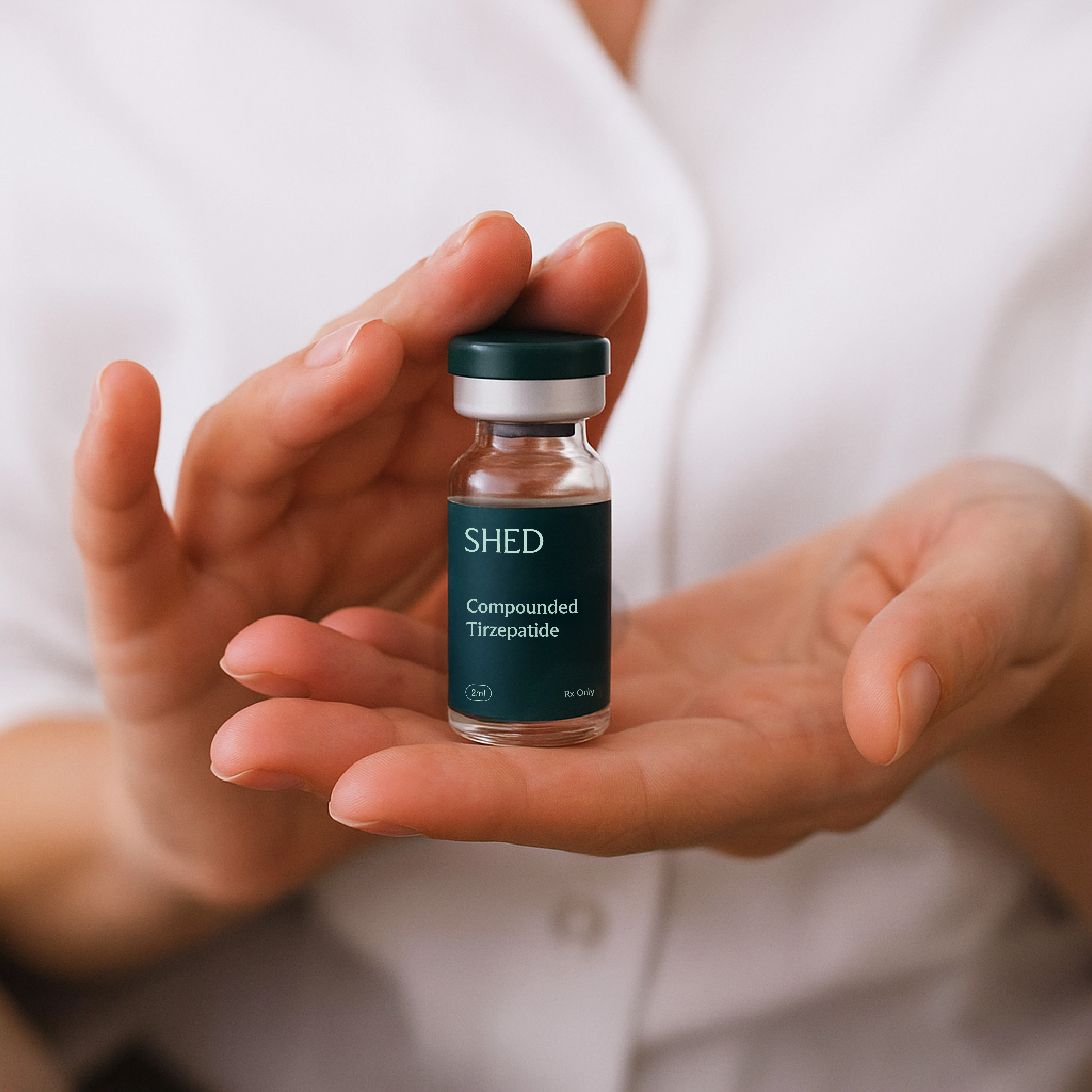 Person holding compounded tirzepatide vial