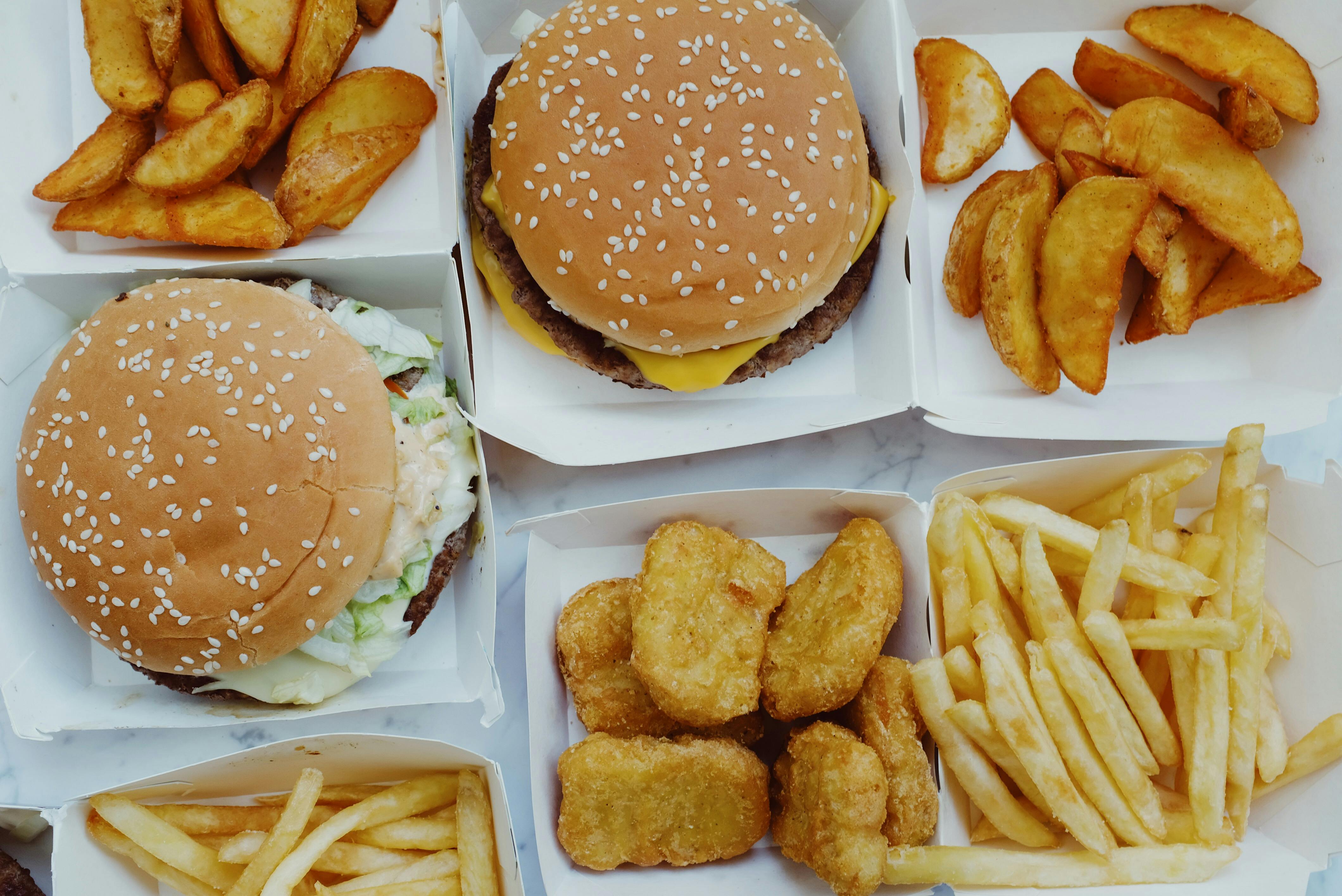 French fries, burgers, and chicken nuggets, all foods that should be avoided on a GLP-1