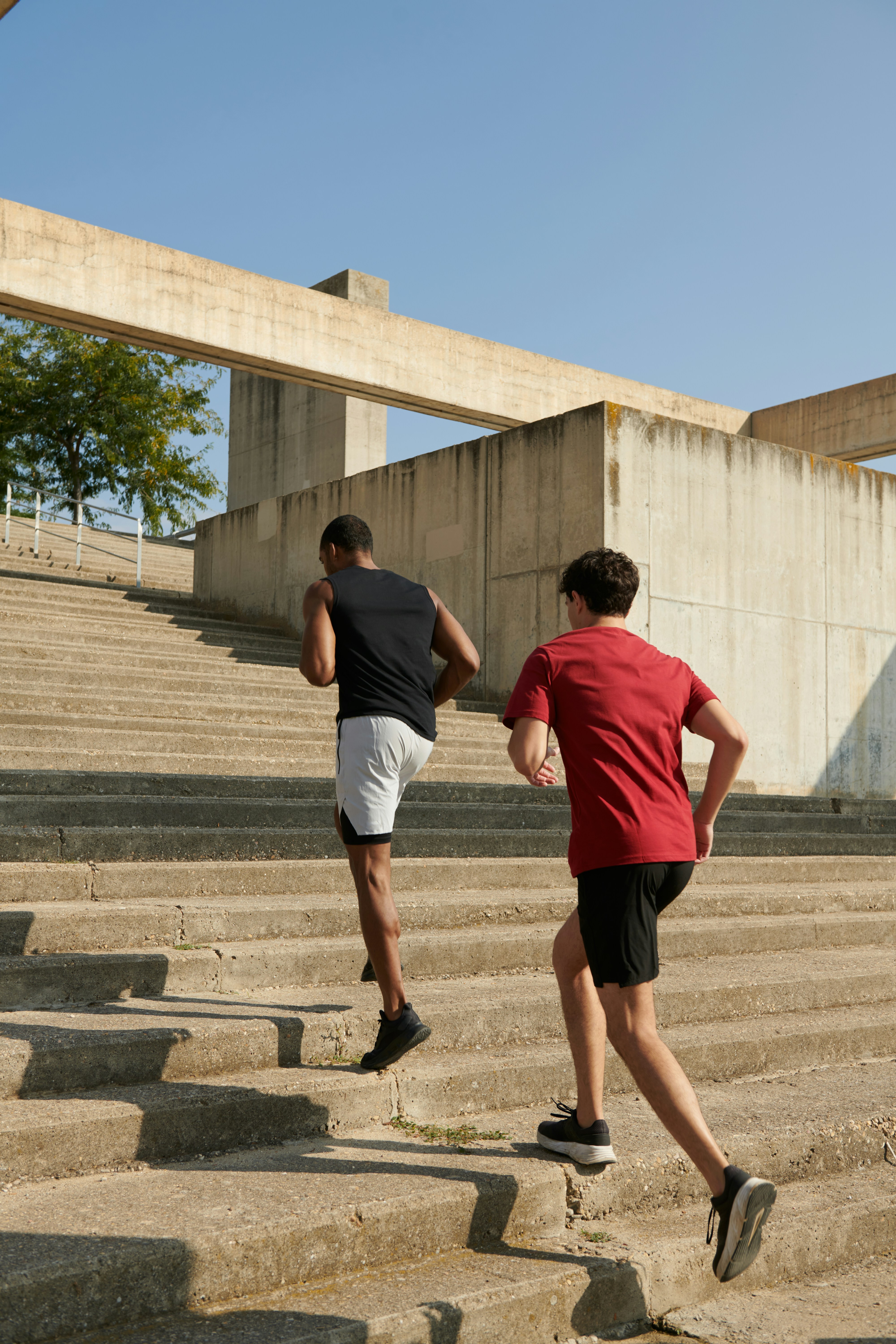 Two men running up steps to support longevity