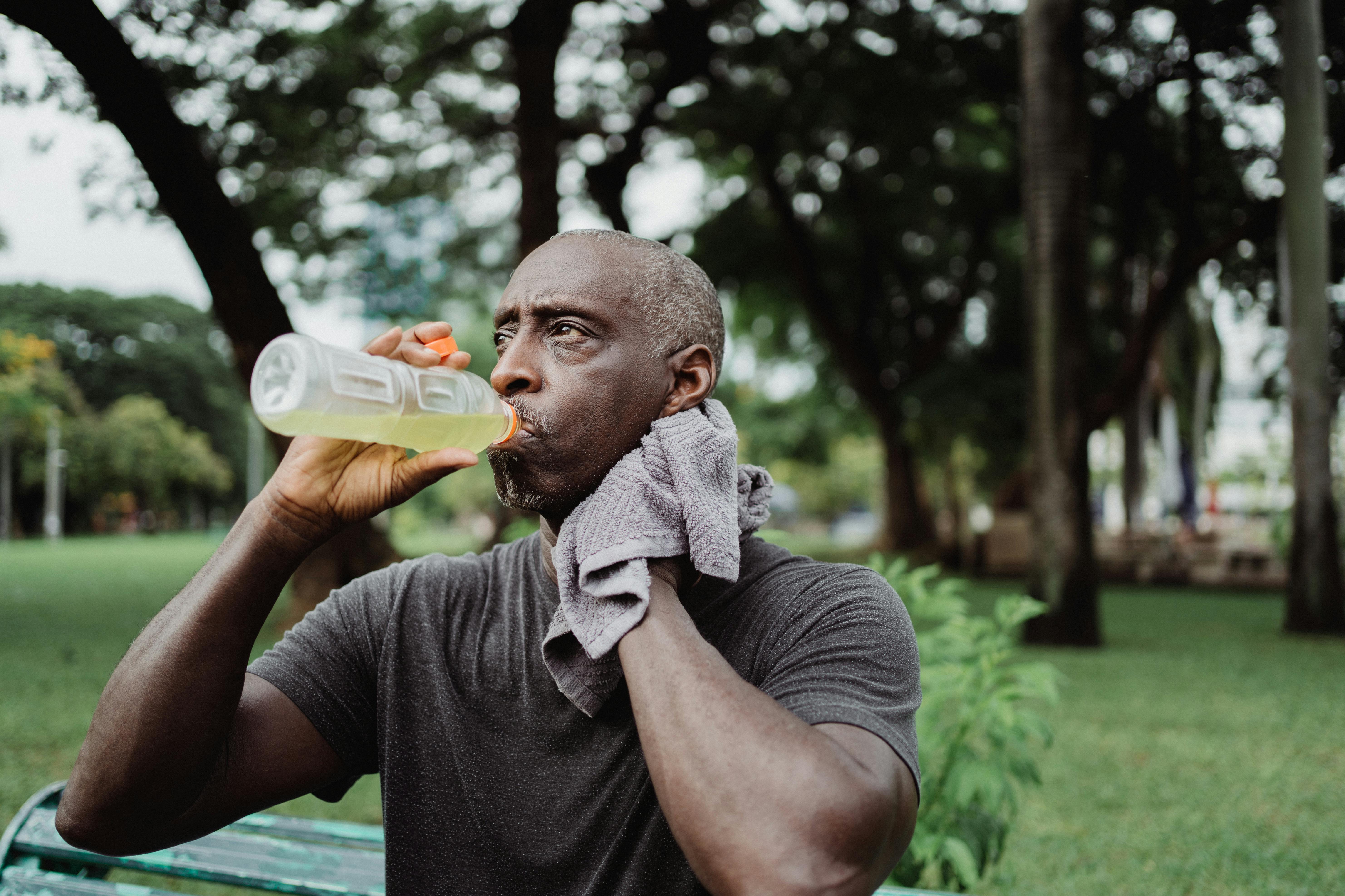 Man drinking electrolyte drink after working out