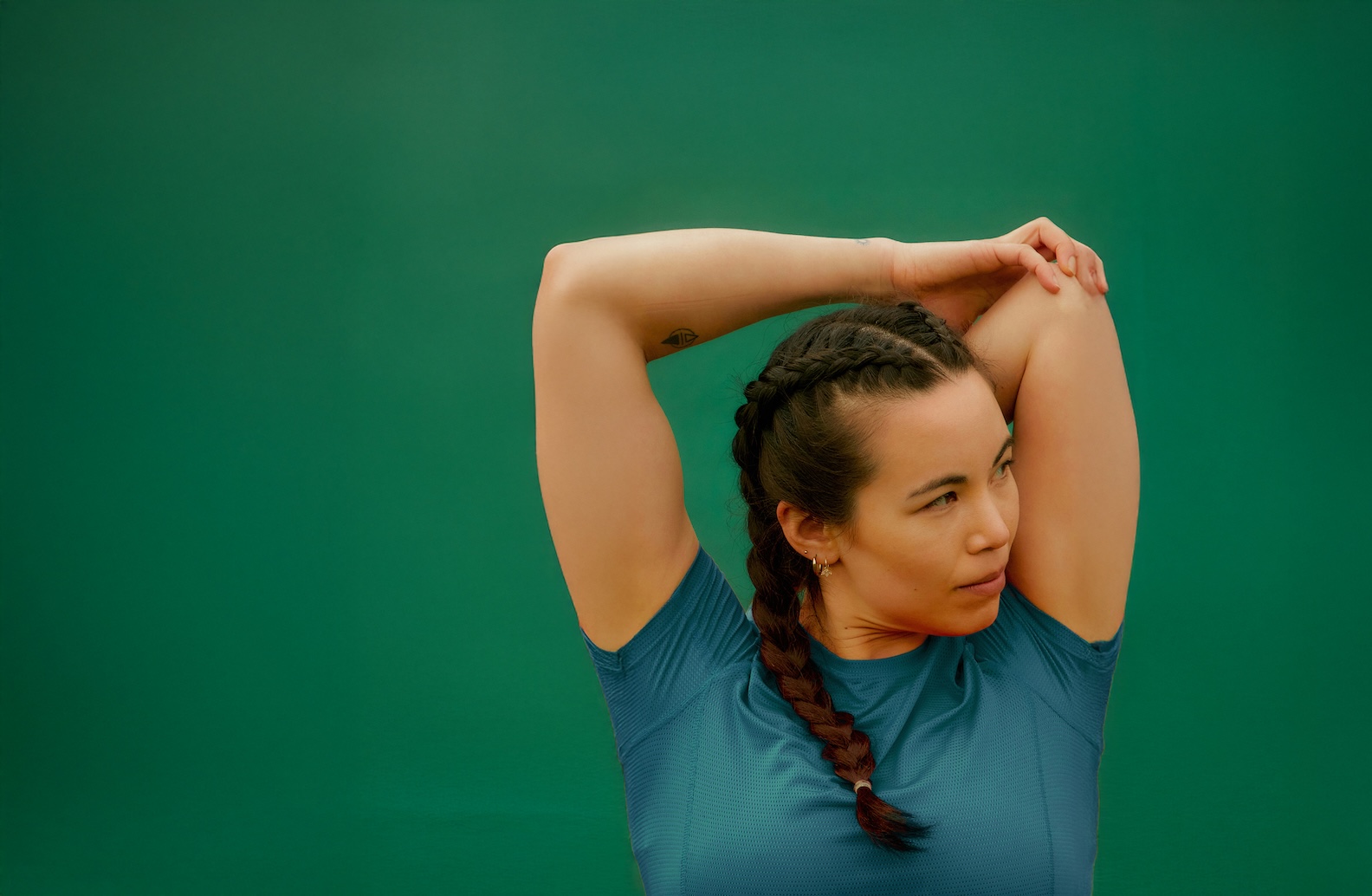 Woman doing stretches before or after exercise