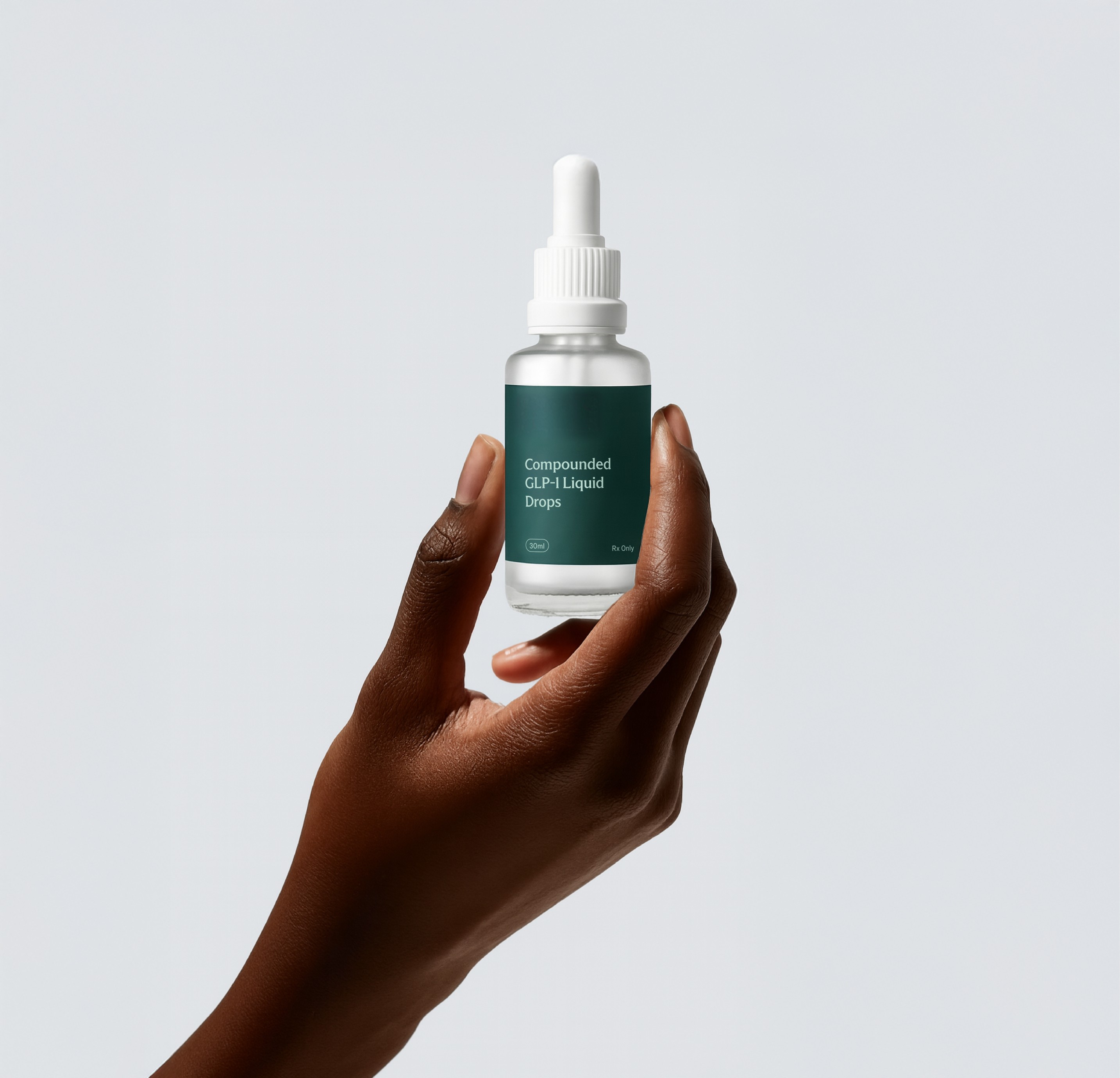 Hand holding vial of compounded GLP-1 drops