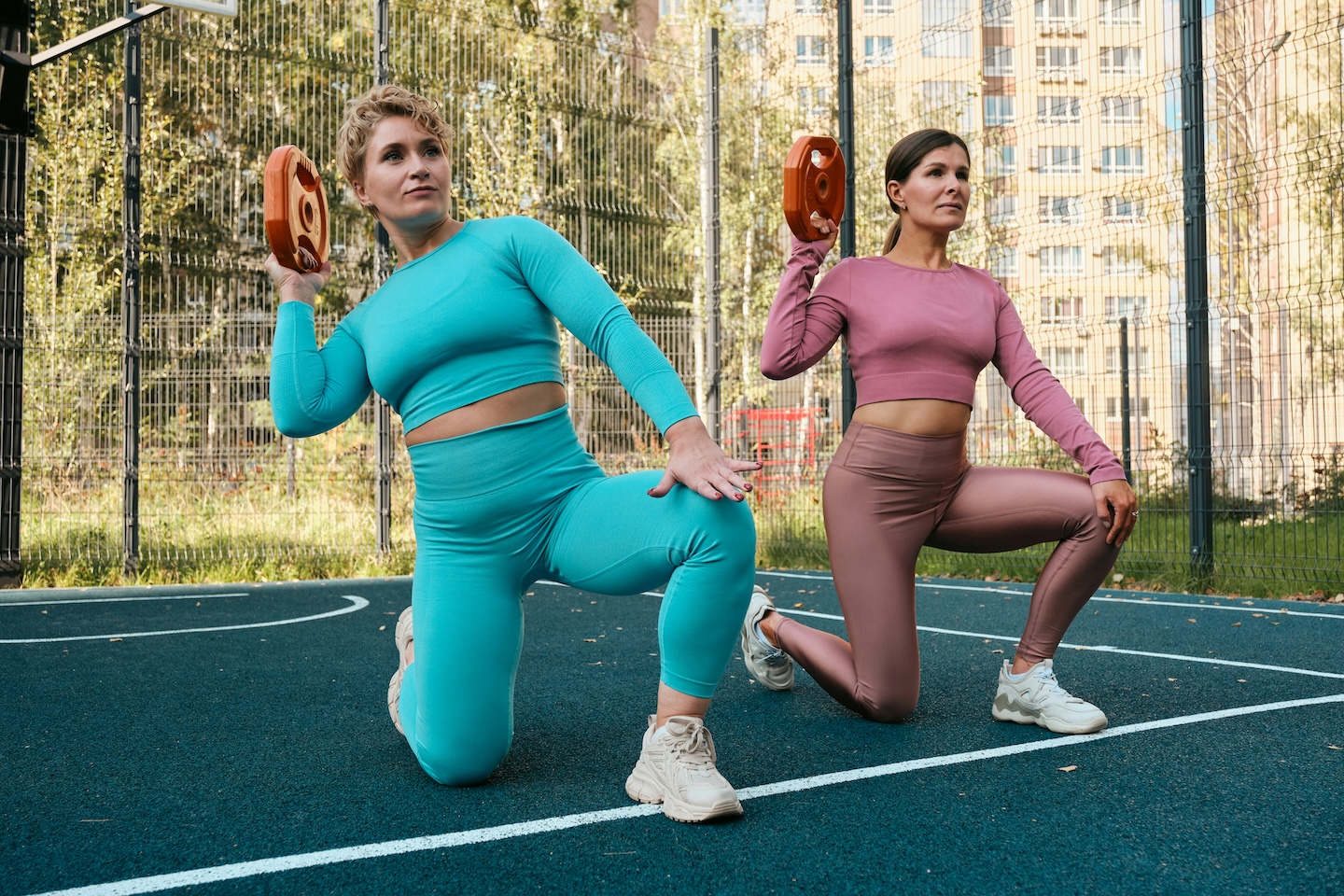 Two women doing strength training exercises