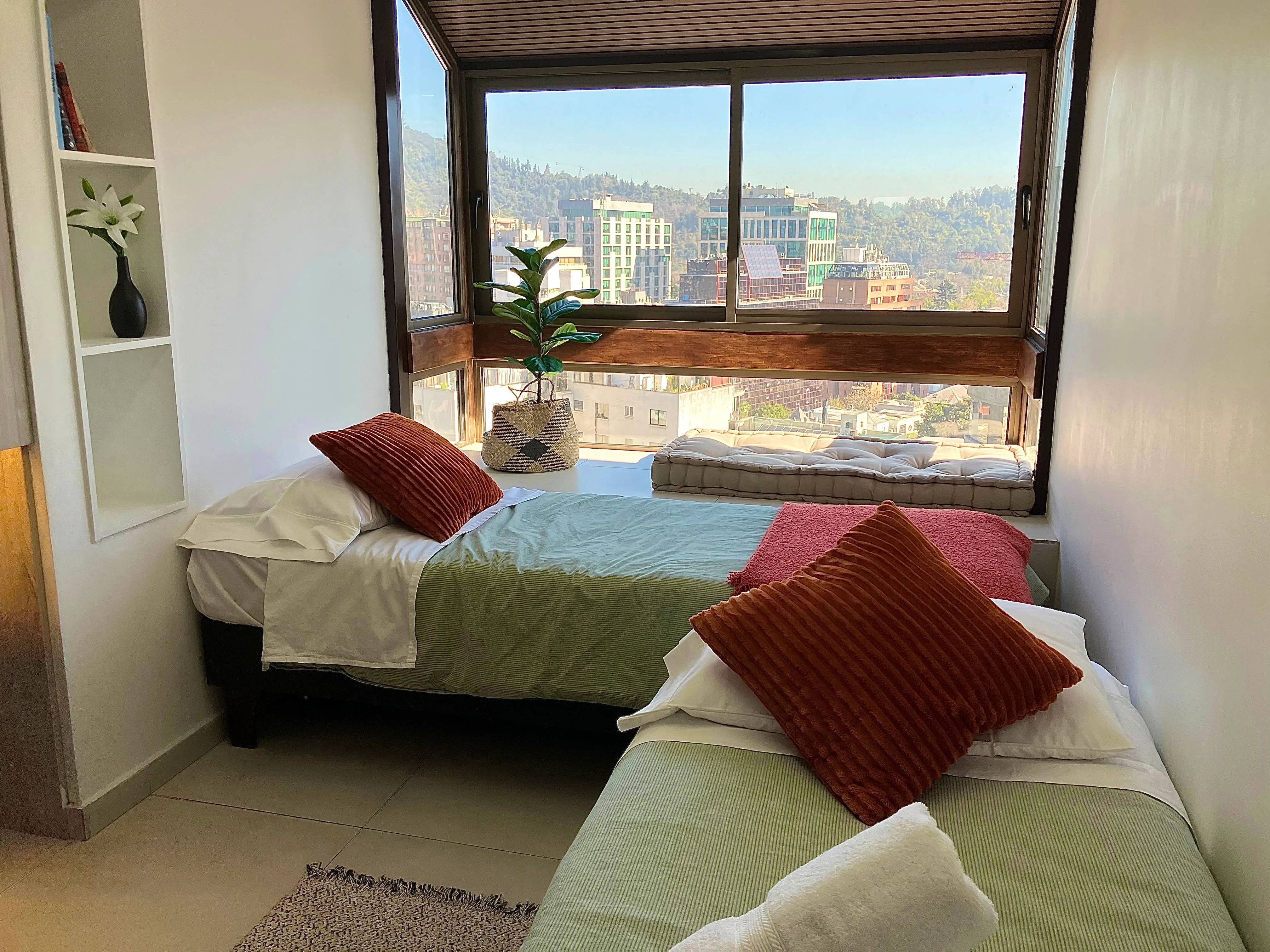 Bright second bedroom at Suite152 featuring flexible bedding and abundant natural light