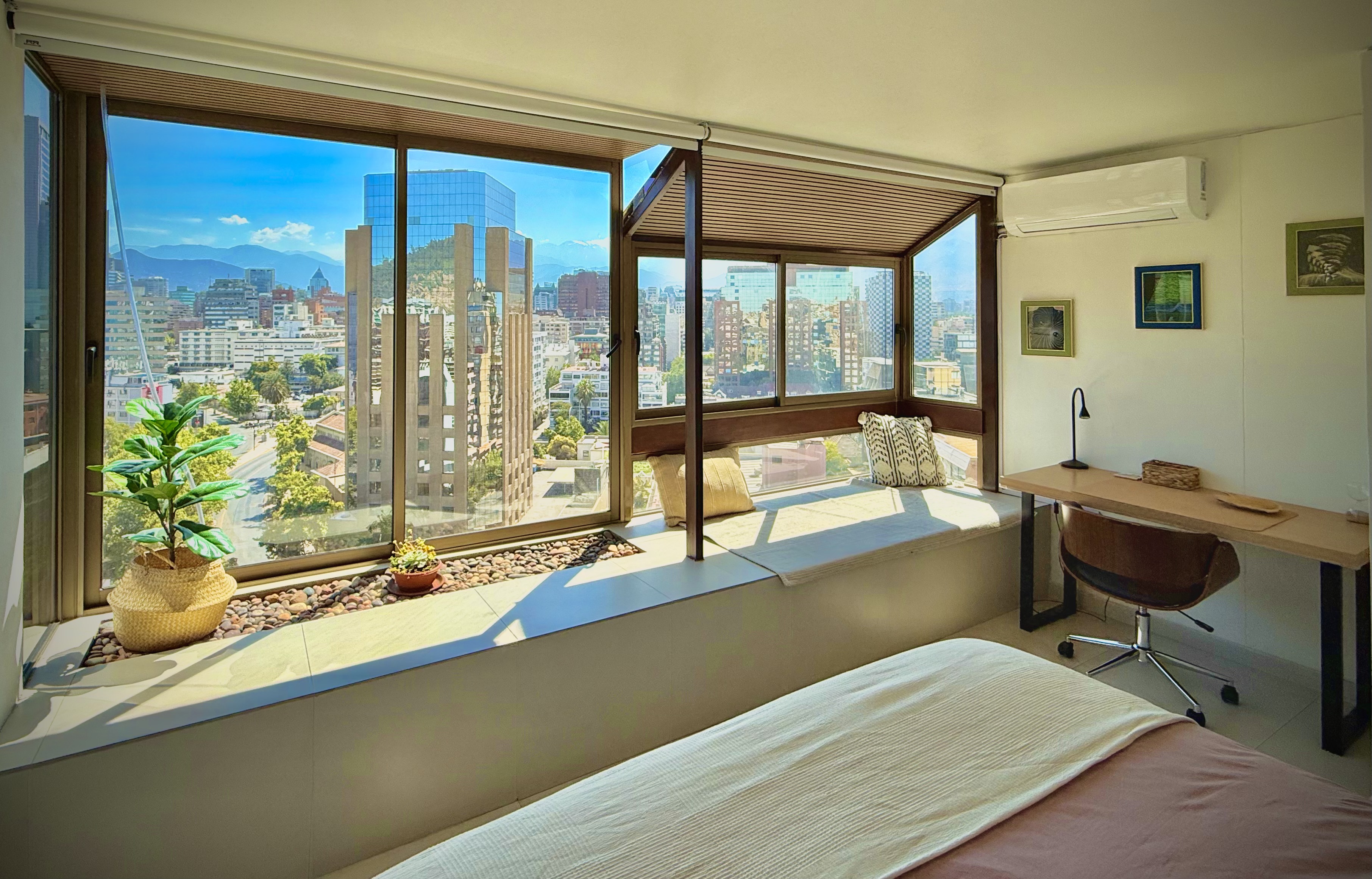 Master bedroom at Suite152 with desk and large windows