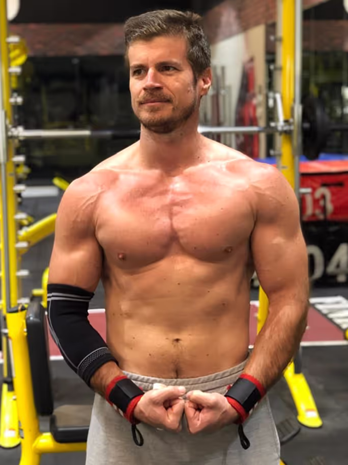 PTD client flexing his physique after the transformation