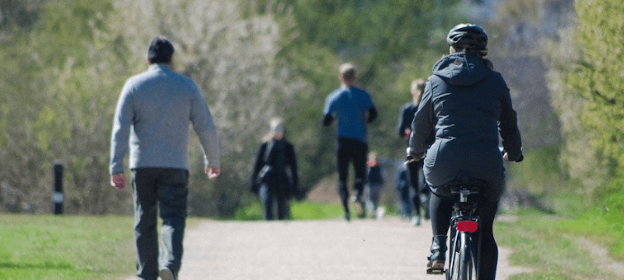 People walking and cycling on a traffic-free path