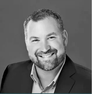 Smiling man in black and white