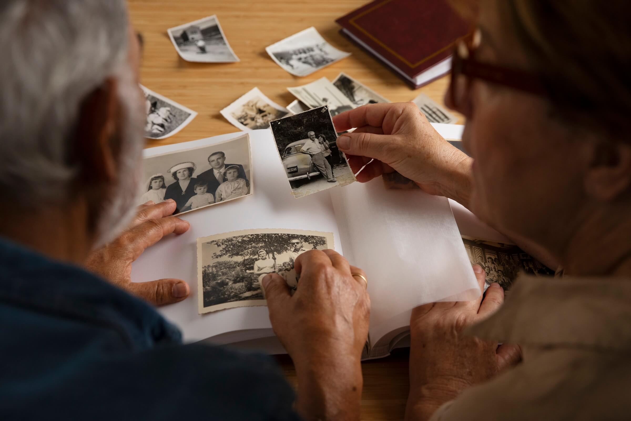 older couple looking at photo album