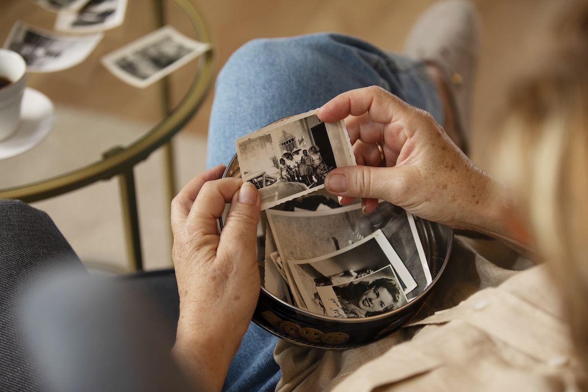people looking through old photos