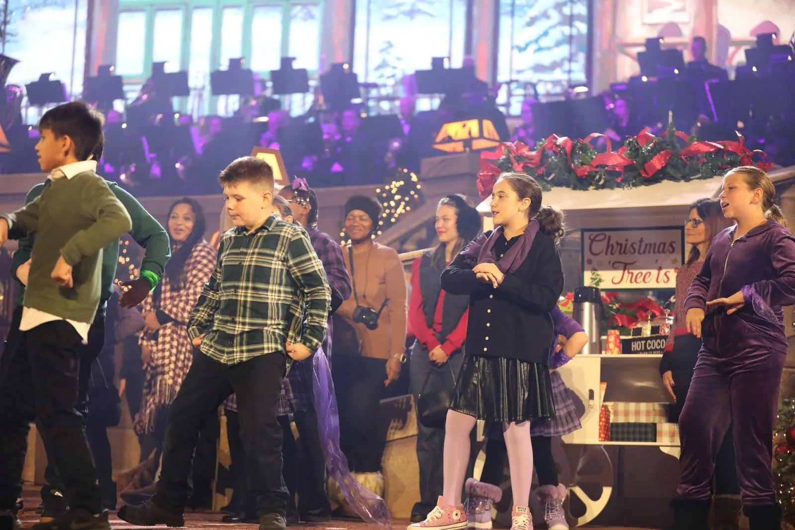 Performers on the Christmas village set