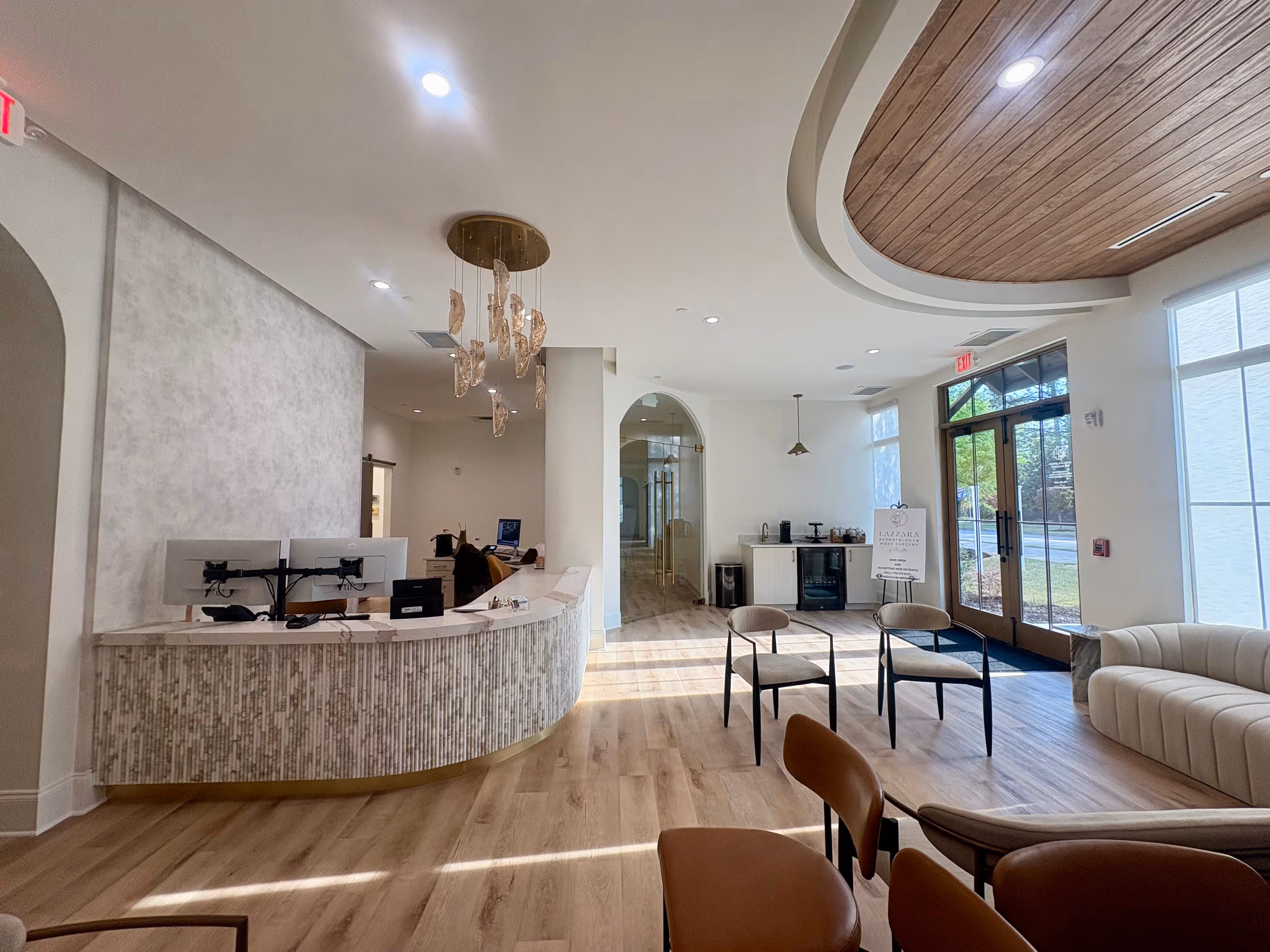 A living room filled with furniture and a chandelier.