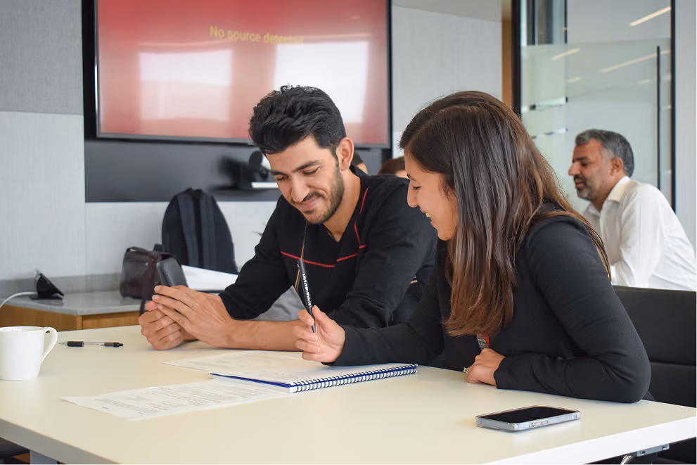 Man and women engaged in conversation