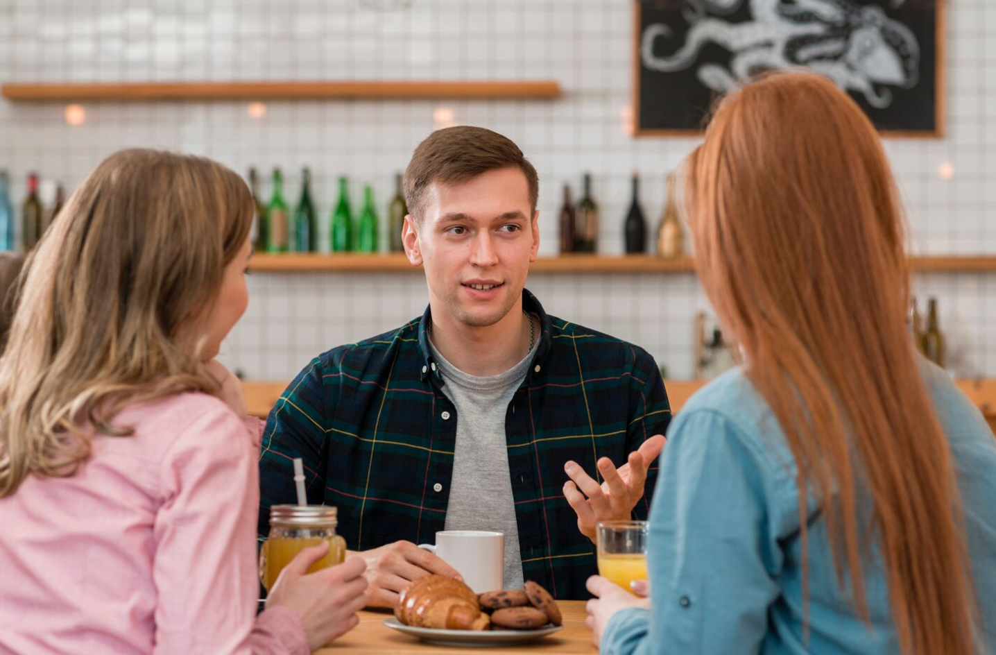 A group of three people talking to one another and rebuilding their relationship during rehab