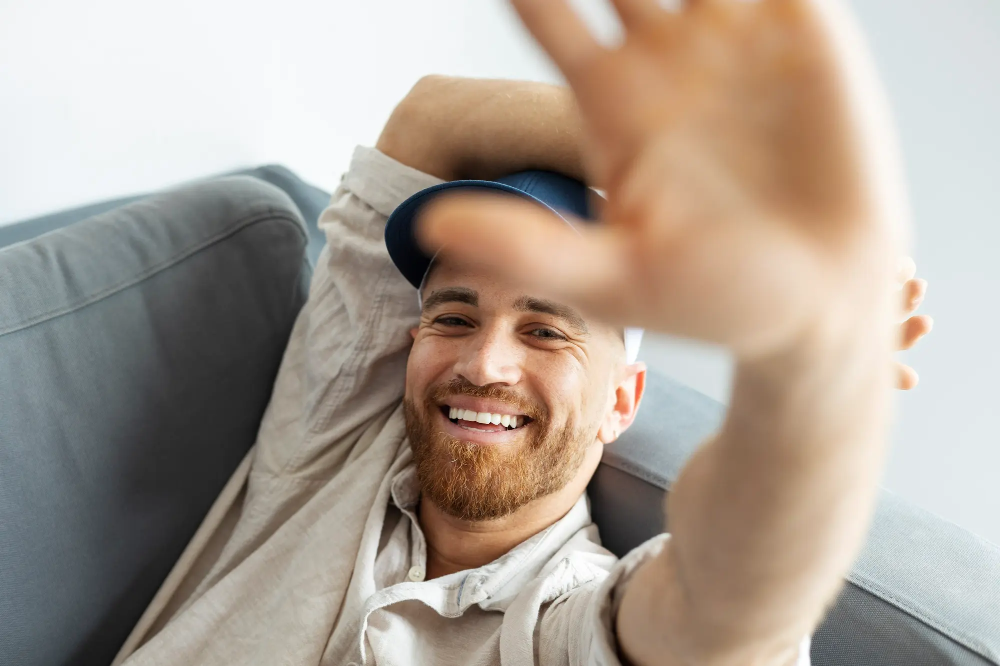 Smiling resident in a sober living house enjoying a positive moment, illustrating confidence, community, and ongoing recovery after rehab.