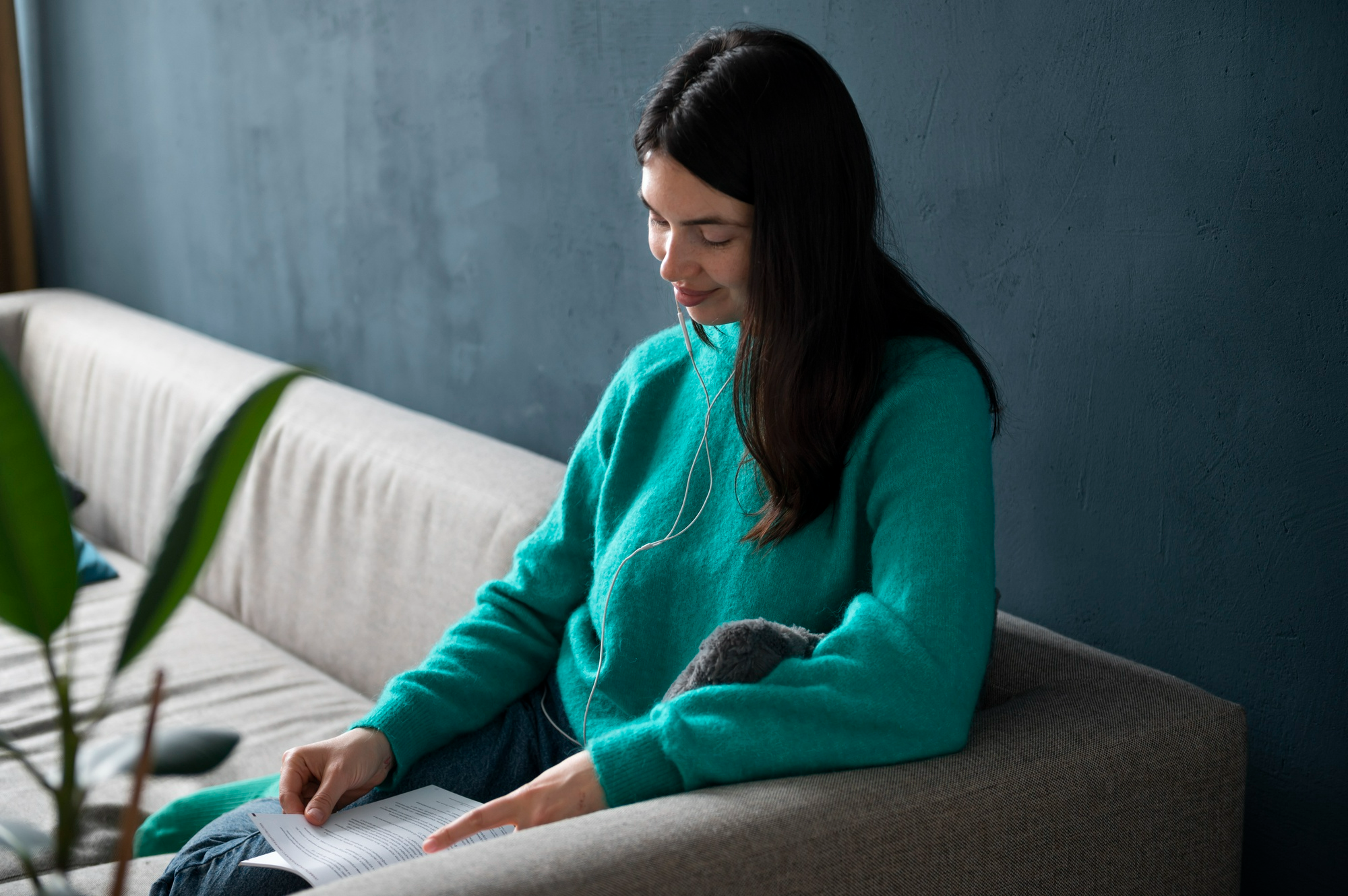 Woman reading recovery materials while relaxing at home, illustrating outpatient addiction treatment and ongoing recovery support in Pocatello.