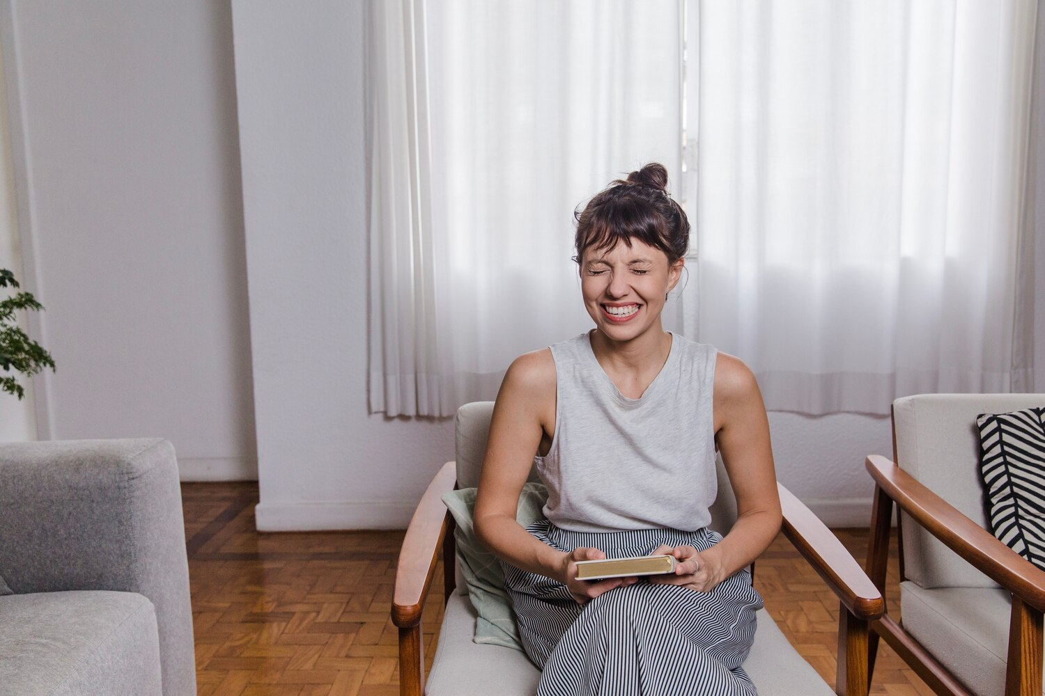 Woman relaxing in a supportive sober living home after inpatient rehab