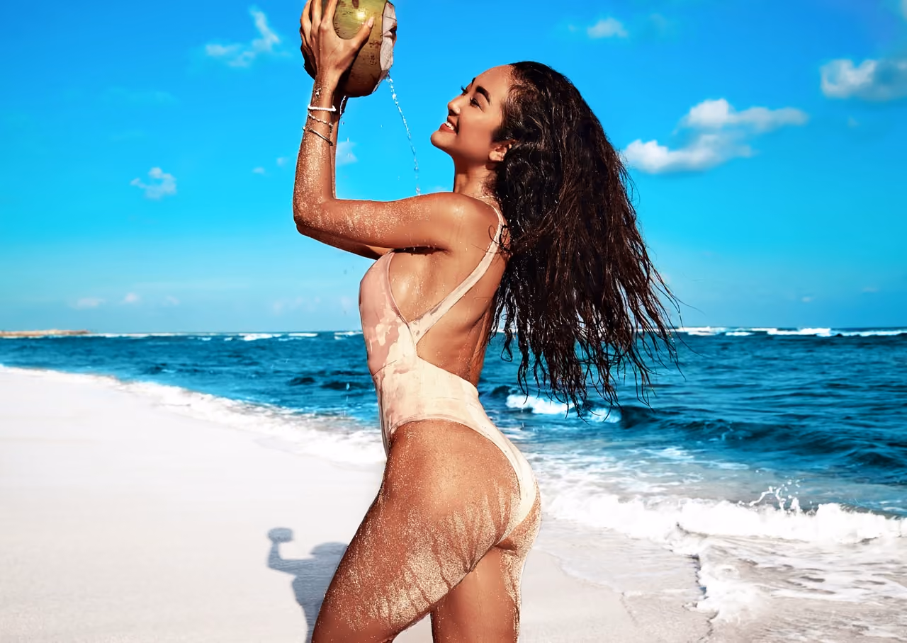 Summer beach woman model posing by the sea, vacation fashion shoot