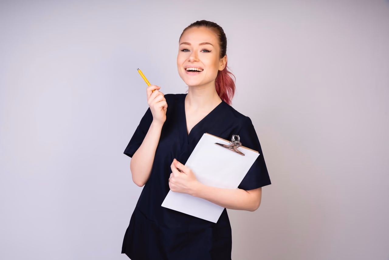 Laughing female doctor in medical uniform, healthcare professional