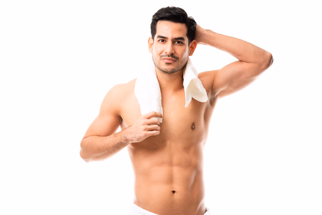 hirtless man walking with surfboard on beach, summer surf lifestyle