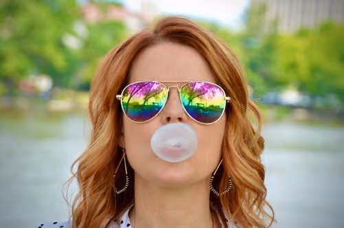 Confident woman smiling, casual portrait on Unsplash