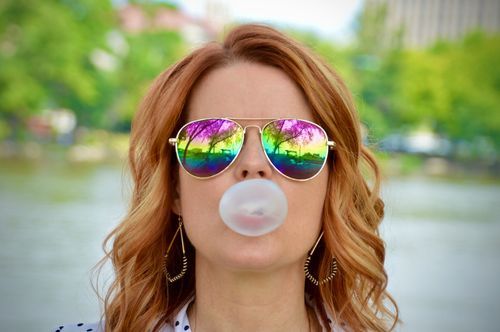Confident woman smiling, casual portrait on Unsplash