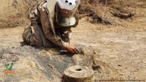 Man digging out mine