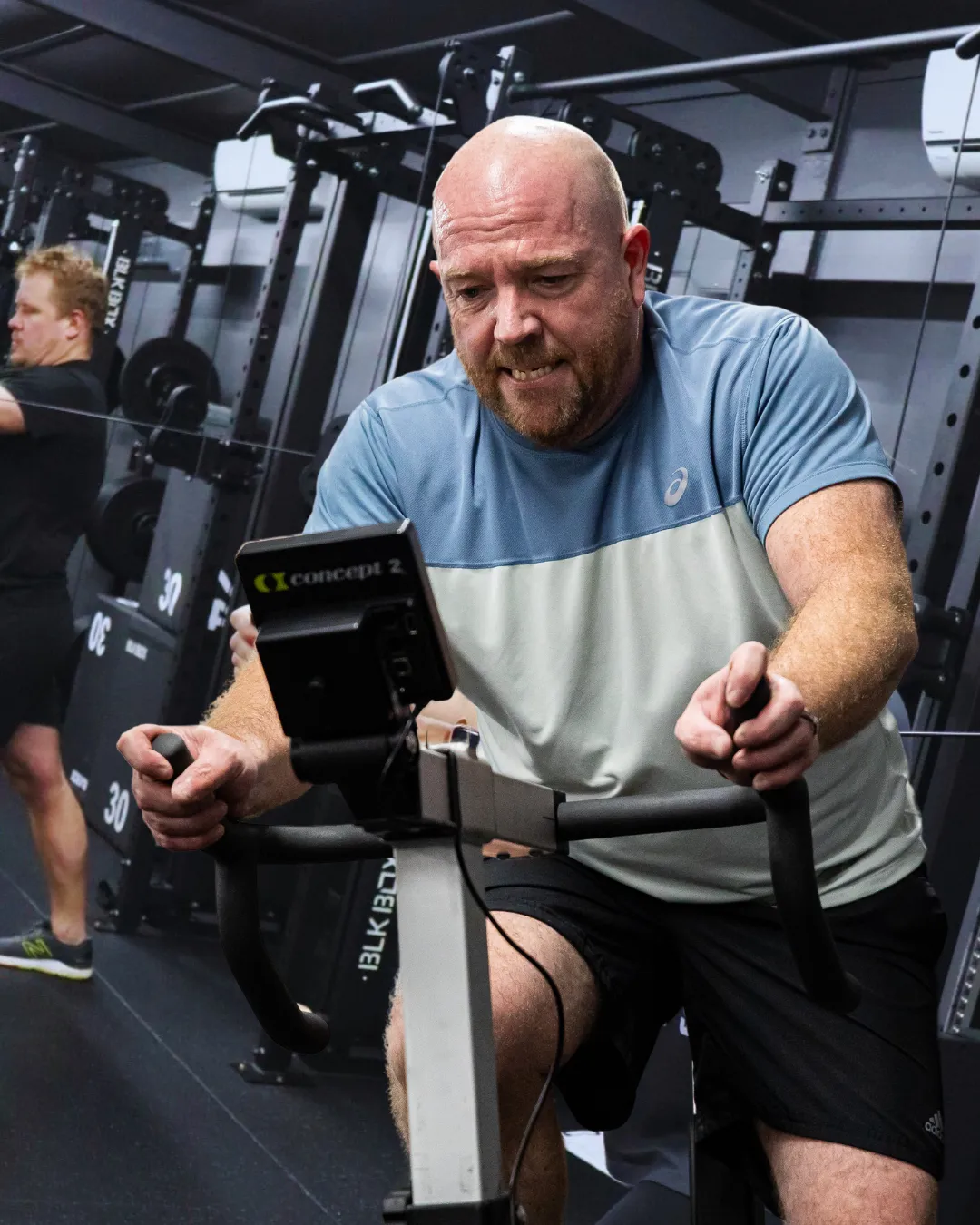 A HUSTLE gym member on a bike