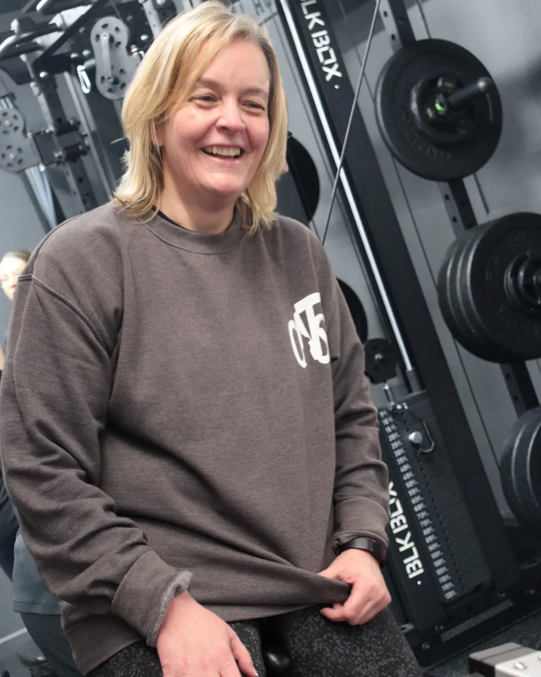 A HUSTLE gym member smiling