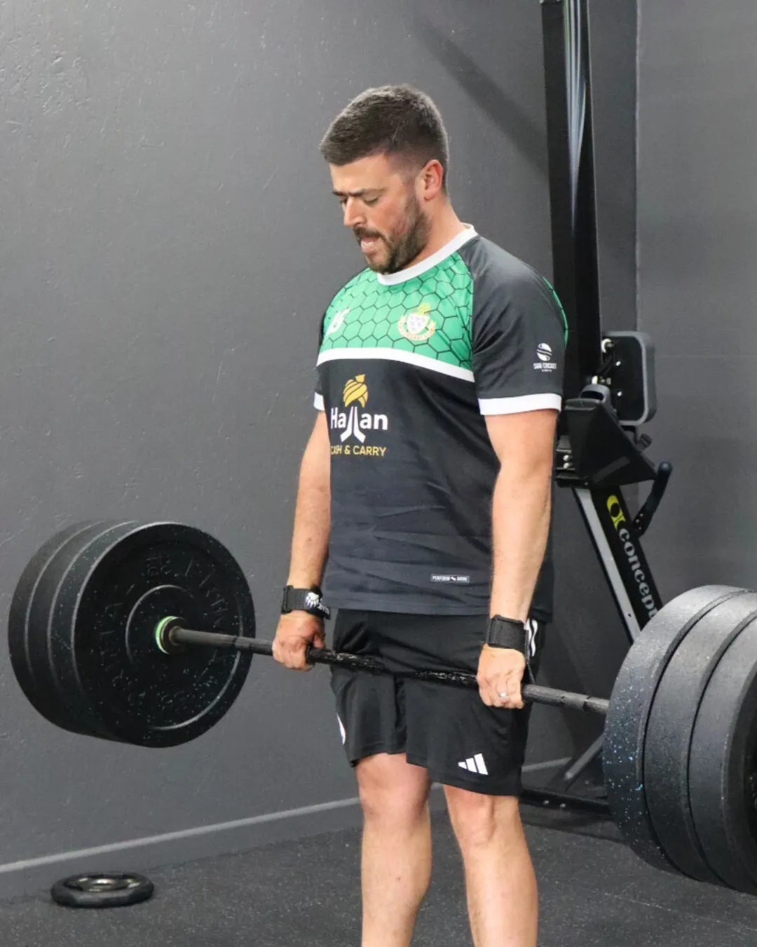 A HUSTLE member doing a deadlift