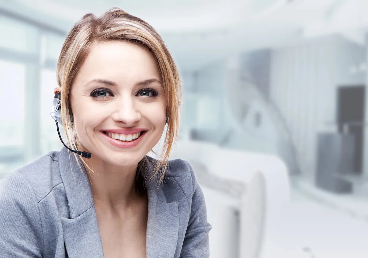 Receptionist smiling to the camera