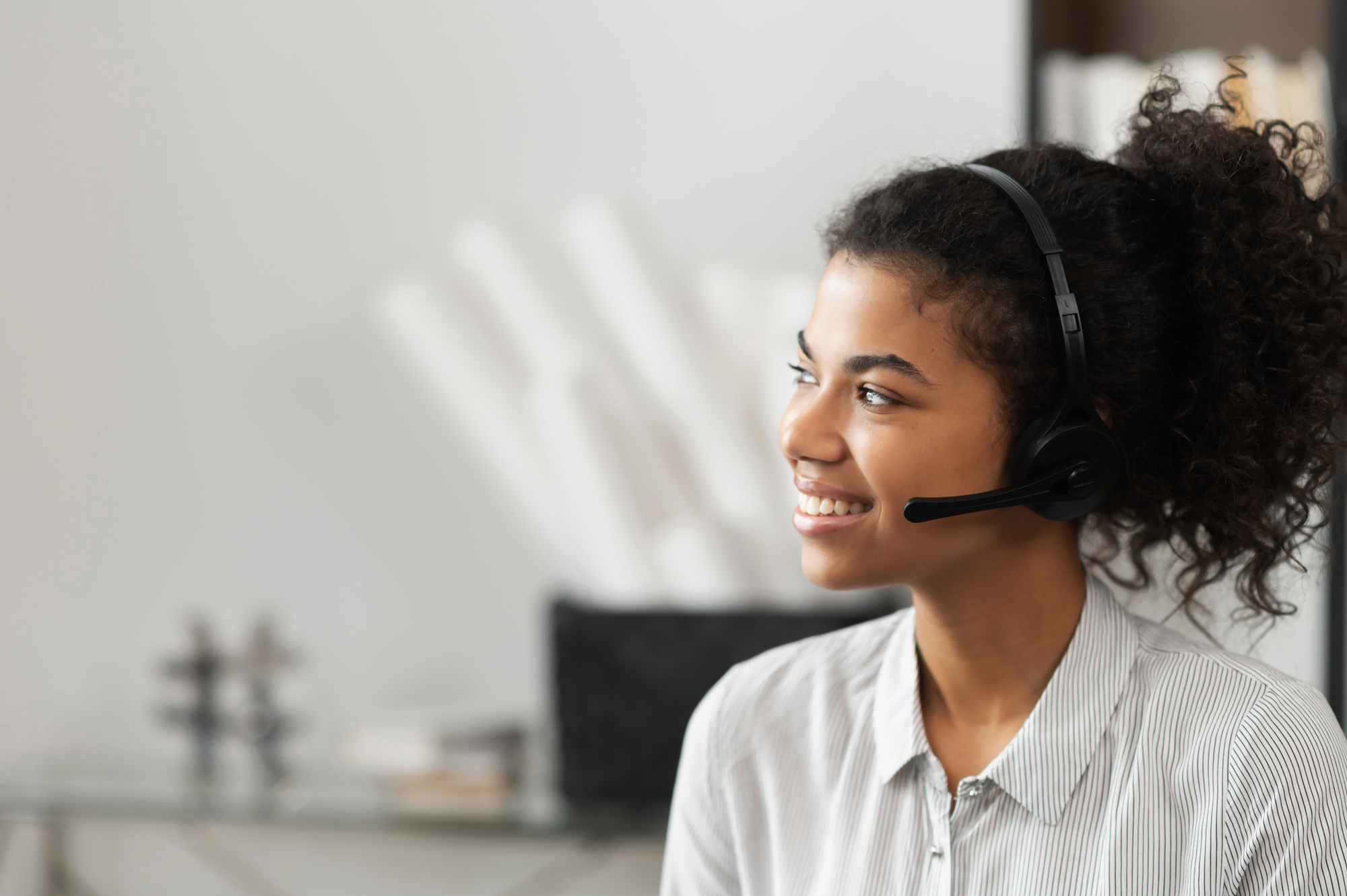 woman smiling while providing live receptionist services