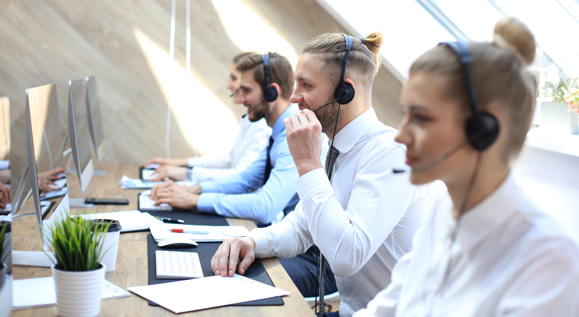 people with headset providing call handling services