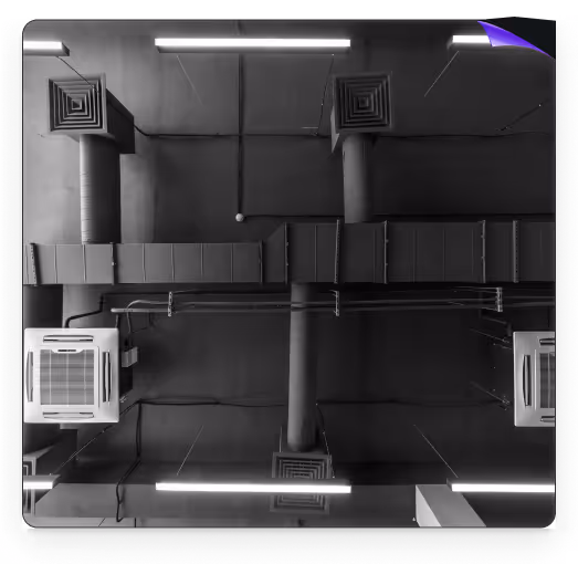 Industrial HVAC system with ventilation ducts and air conditioning units.