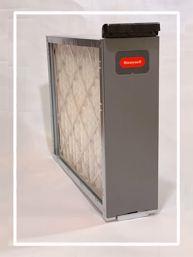 Honeywell air filter in gray metal casing with white filter media