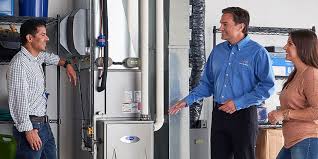 Technicians discussing water heater installation in commercial building