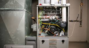 Open HVAC furnace with exposed internal components and wiring