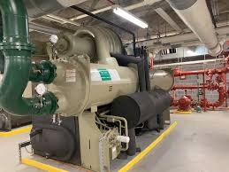 Large industrial centrifugal chiller machine in mechanical equipment room