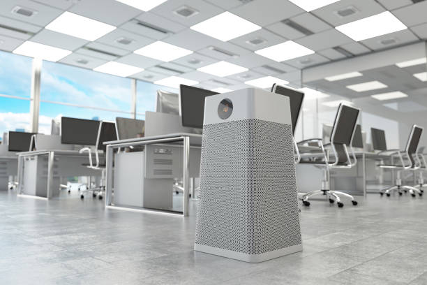 Modern office interior with air purifier and computer workstations