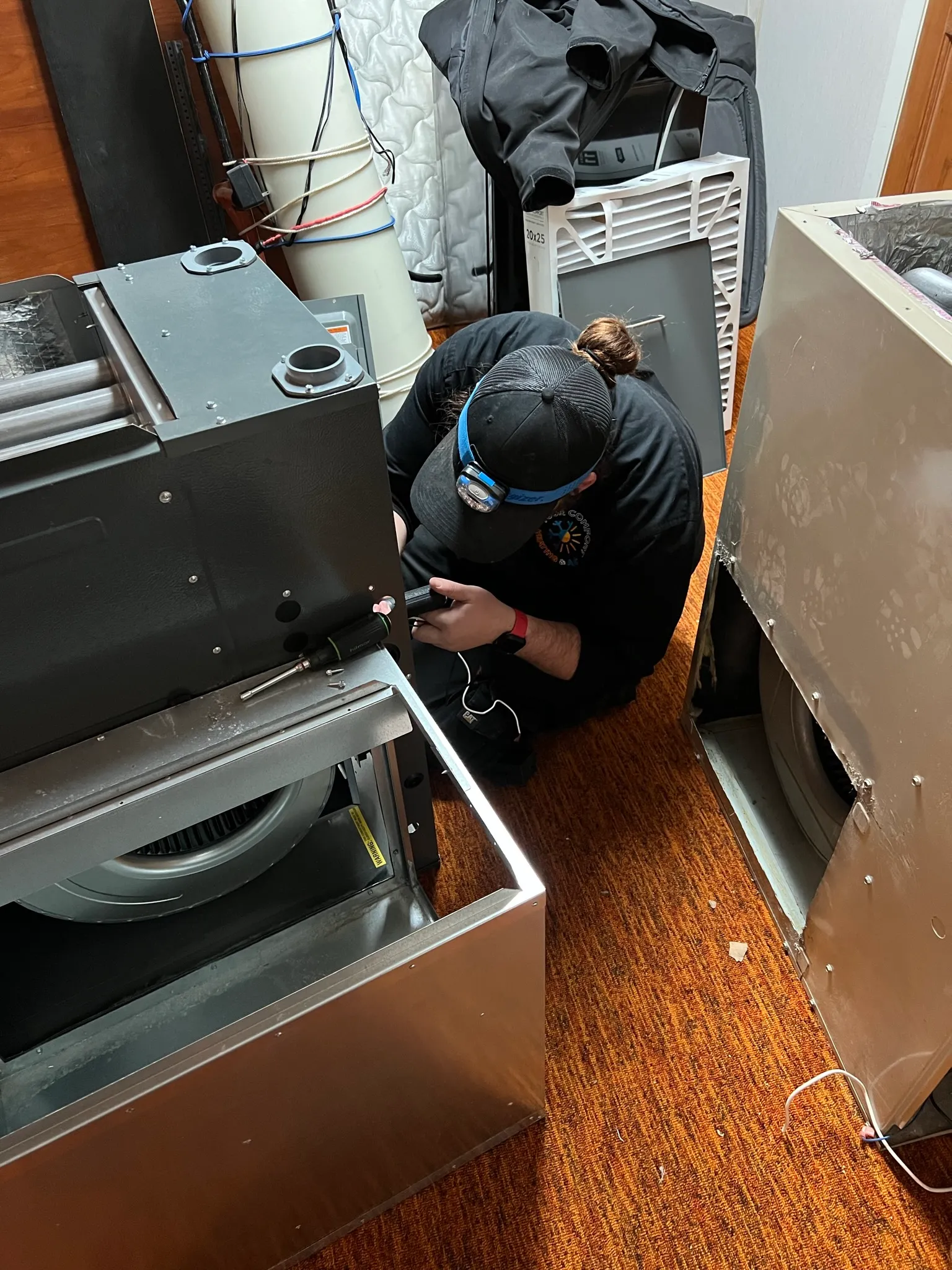 Technicians working on a large HVAC system installation